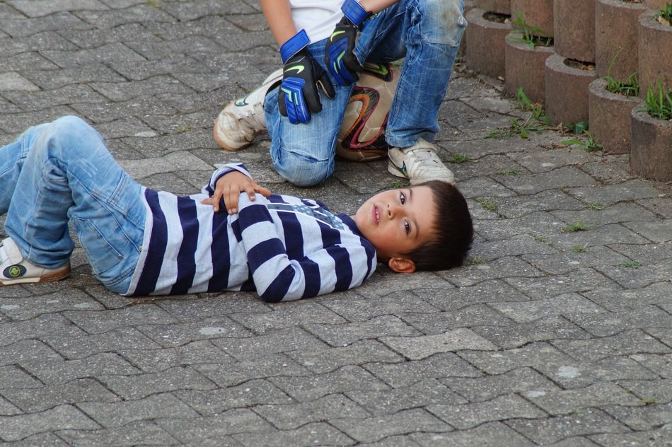 boys resting after football game