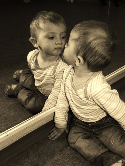 Reflection of the child in mirror