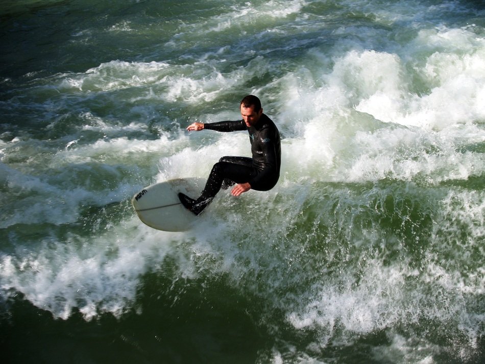Top view of the surfer on the waves