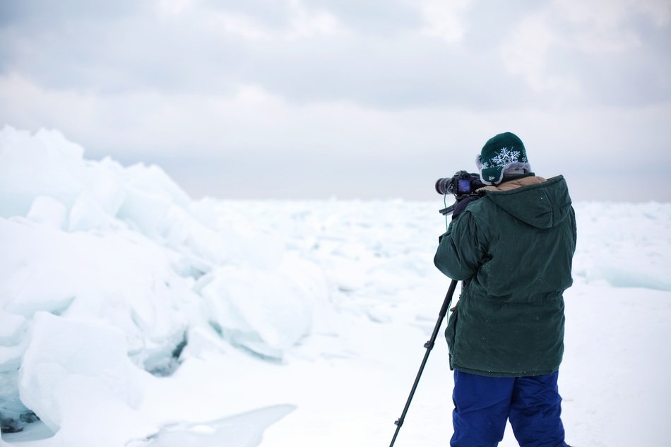 photographer taking picture of lake huron