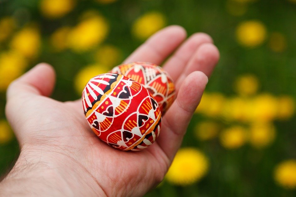 two painted eggs lie in hand