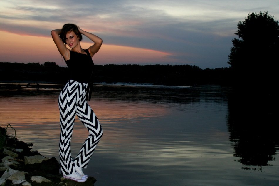 girl posing by the water