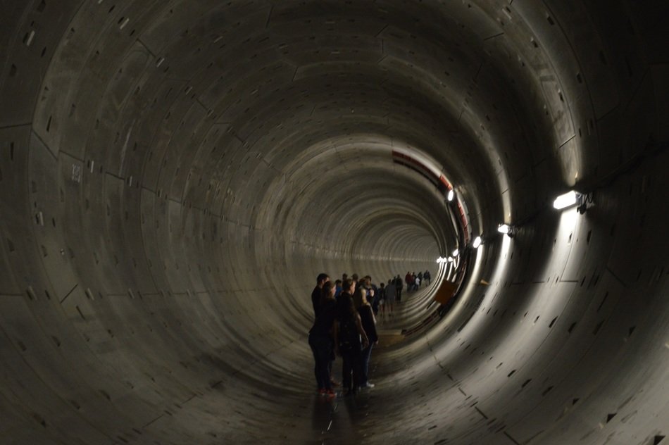 people in grey dark tunnen