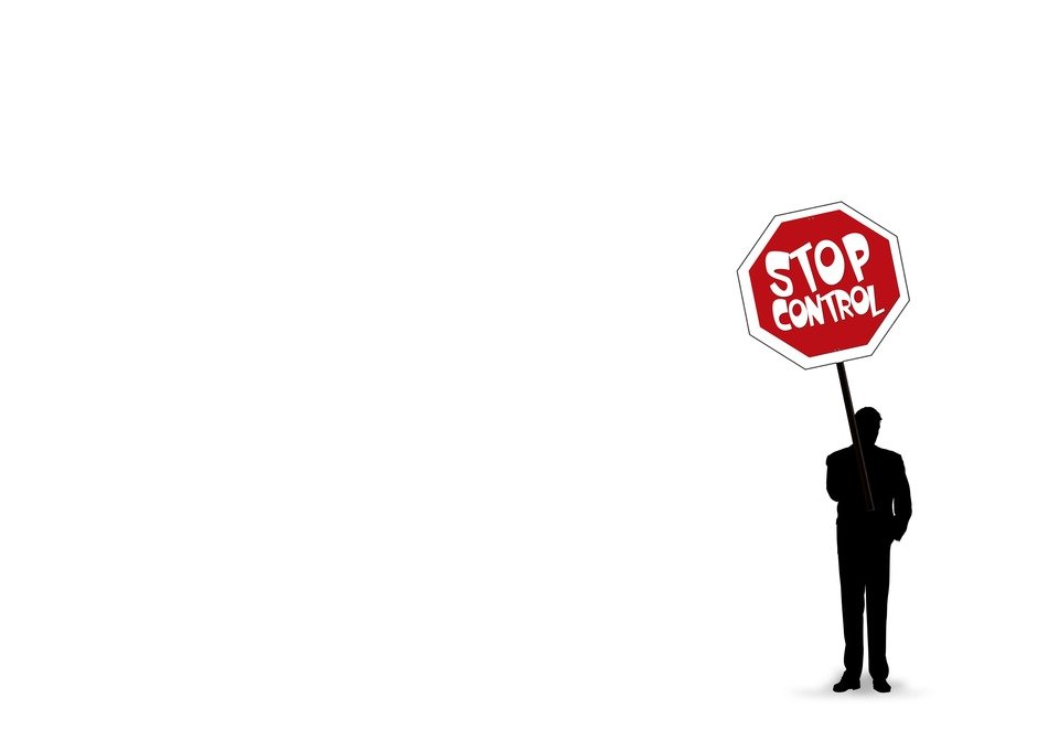 Silhouette of the man with 'STOP Control' sign