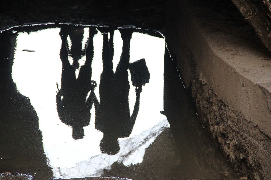 mirror image of people in the water