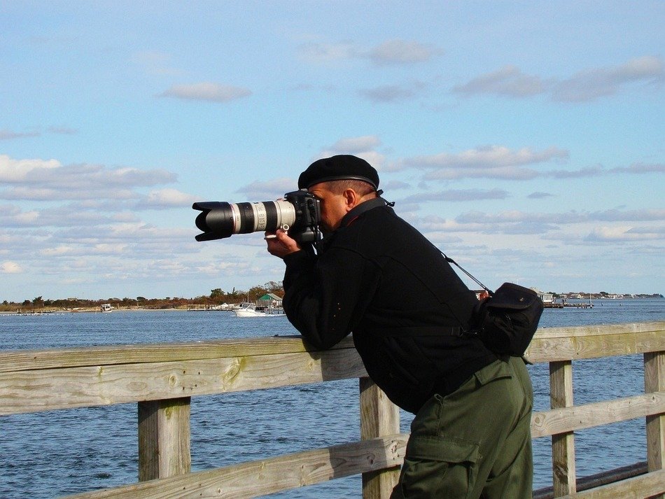 man photographer at the river