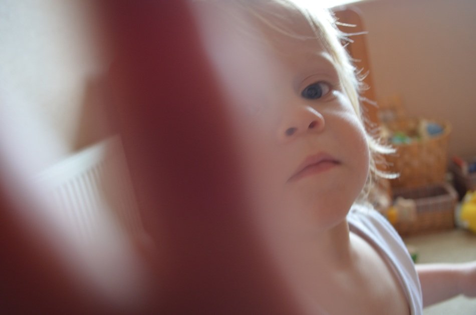 child shields itself with hand