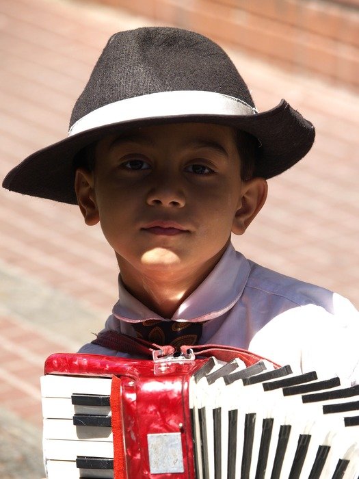 child in hat and with Bayan