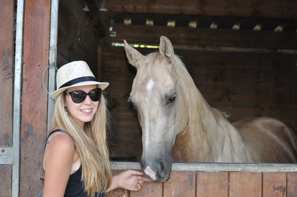 beautiful blonde near the horse
