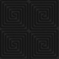 Textured black plastic square spirals reflected