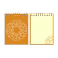 Orange cover notebook with round ornate pattern