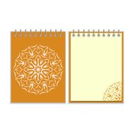 Orange cover notebook with round florwer pattern