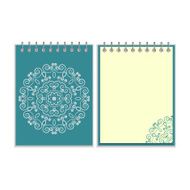 Blue cover notebook with round floral pattern