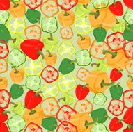 Seamless colorful background made of slices and whole peppers