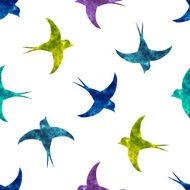 Swallow silhouettes with colorful watercolor fill seamless pattern