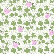 Seamless pattern with clover on the polka dots background