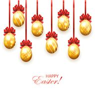 Golden Easter eggs with bow