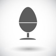 Egg on stand single icon