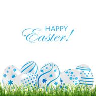 Blue Easter eggs in the grass