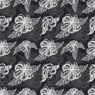 Seamless pattern with white flowers on a black background