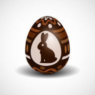 chocolate Easter egg with ornament and rabbit