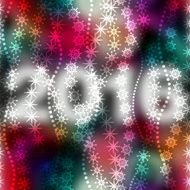Snowflakes on blur color background with numbers 2016