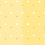 Seamless pattern with white and pink hearts on a yellow