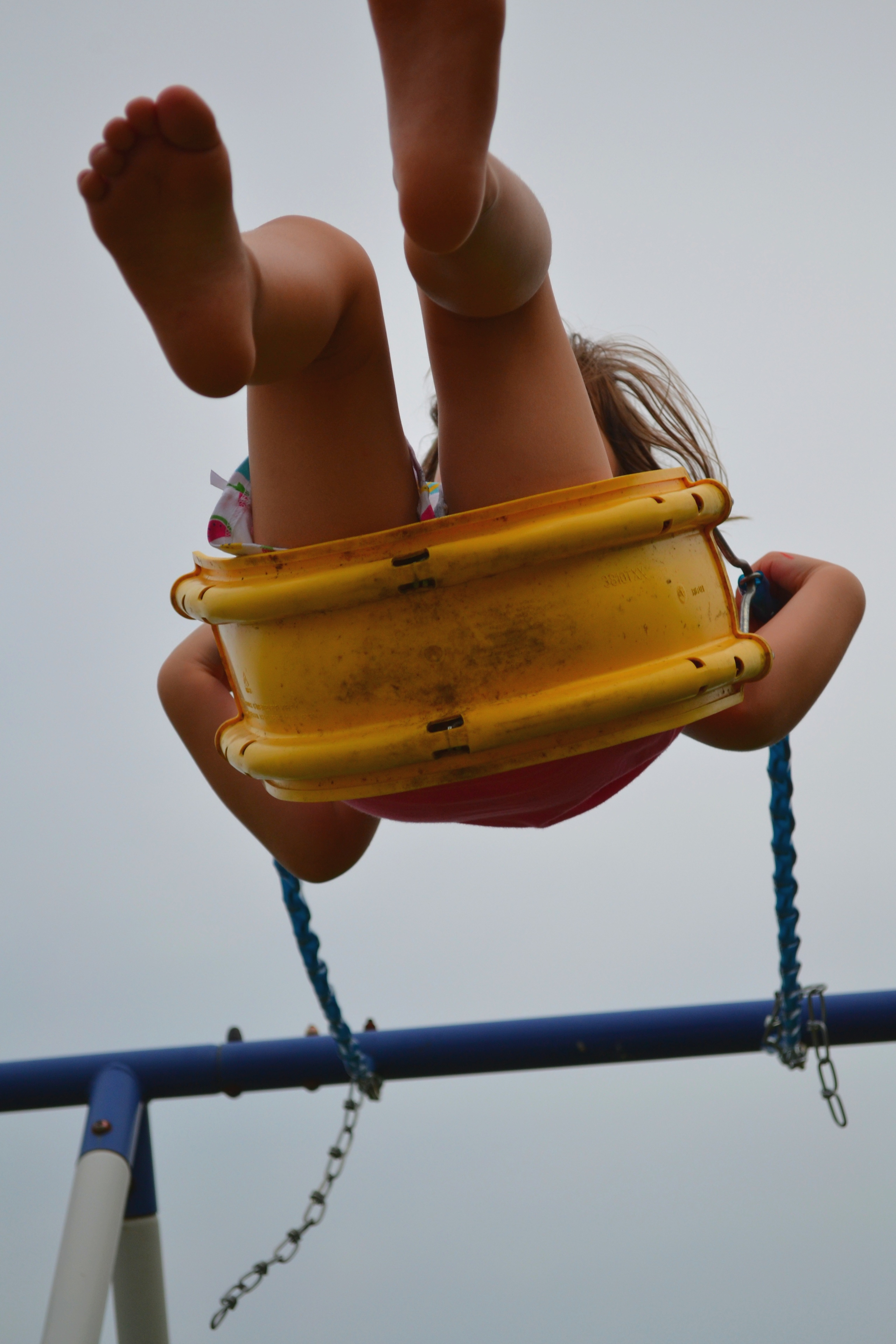 Girl barefoot riding a swing free image