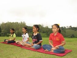 Buddhist children are meditating