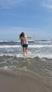 insanely beautiful girl play by beach