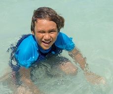 happy boy in ocean