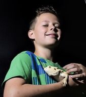 happy boy with lizard