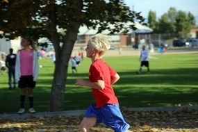 running boy in red shirt