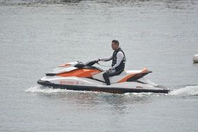 man riding jet ski