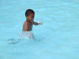 black boy in the blue pool