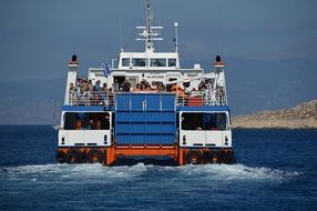 people on ferry in sea at island, greece, chalki