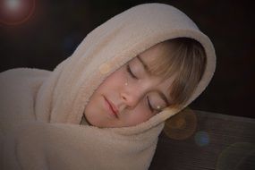 sleeping girl with blanket on head
