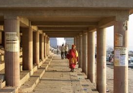 people between the pillars in indian architecture