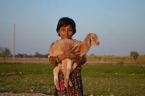 child and goat