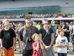 caucasian people watching air show