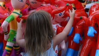 girl among inflatable dolls