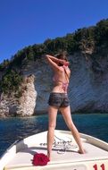 girl in a bathing suit on a boat