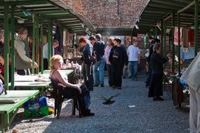 tourists on street market, poland, krakow
