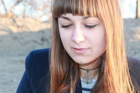 girl looking down thoughtfully