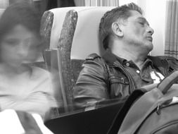 sleeping man in transport