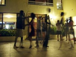 people dance salsa on the dance floor