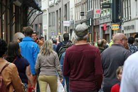 people walking on busy street, netherlands, amsterdam