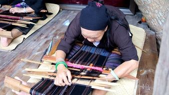 aboriginal woman in spinning process, china, hainan