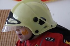 boy dressed up in costume of firefighter