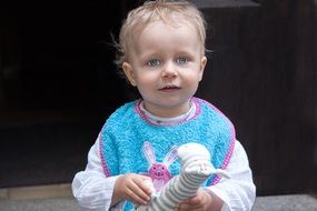 baby with a plush giraffe